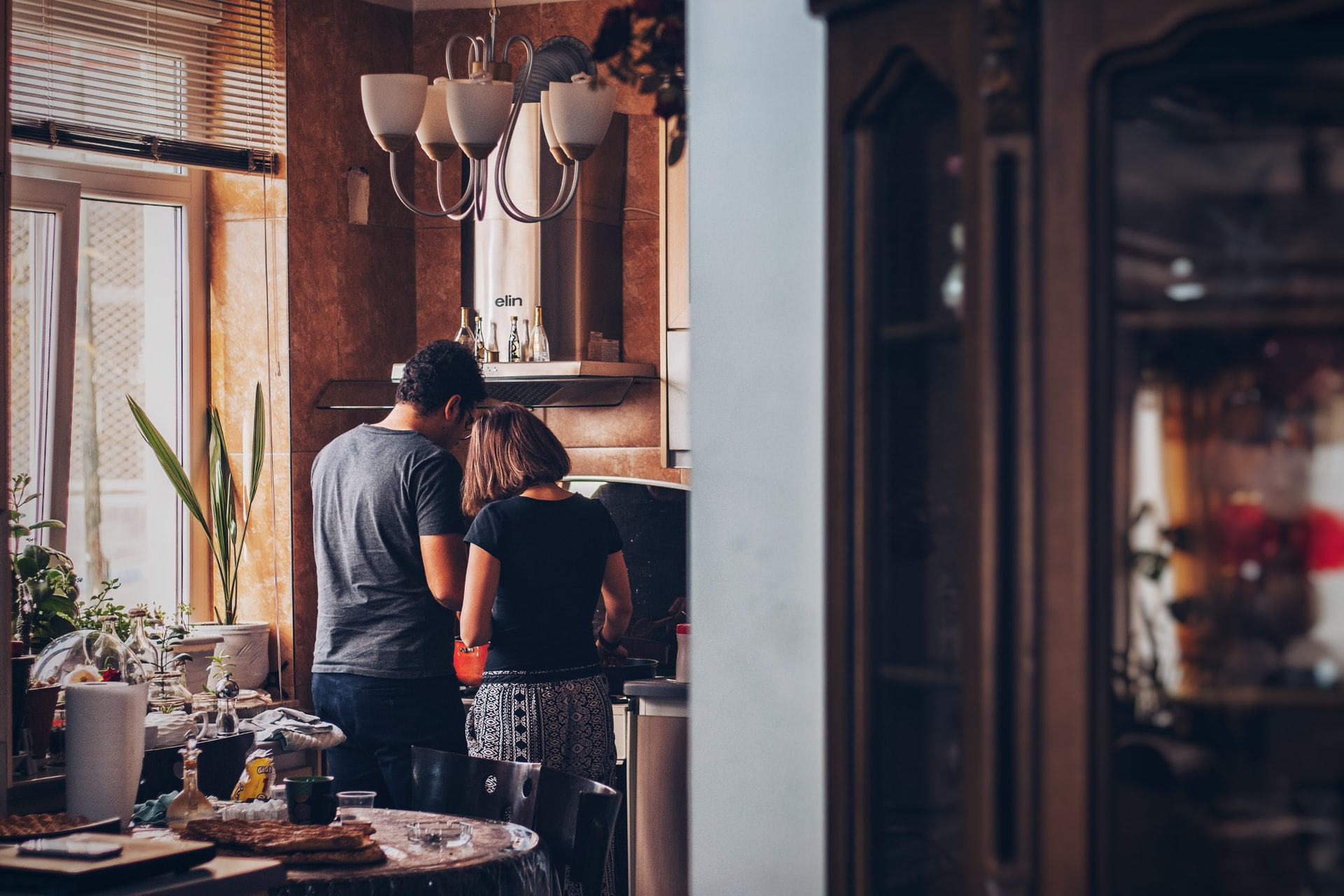 A couple cooking in the kitchen