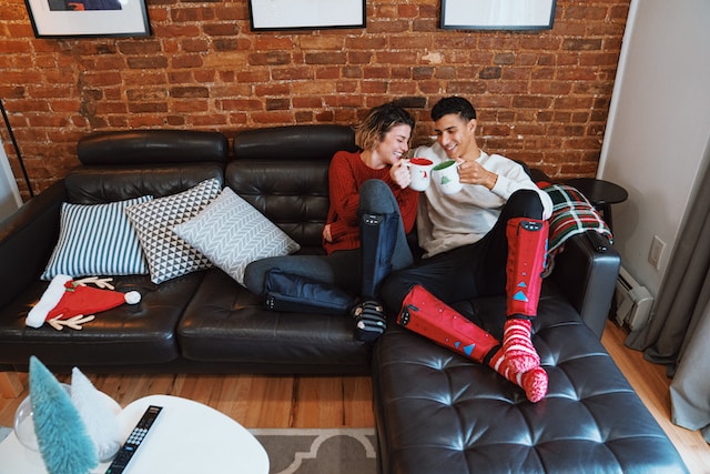 fit couple recovering on the couch